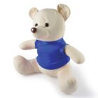 A cream-colored teddy bear wearing a blue shirt sits on a white background. The bear has a round nose, stitched eyes, and slightly open arms.