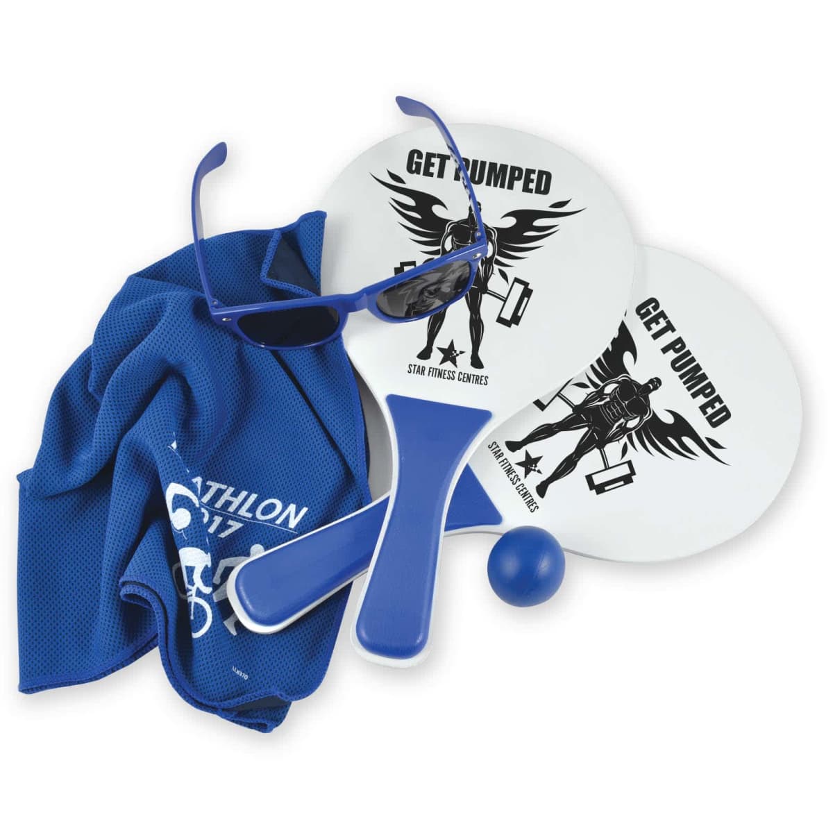 Two white and blue beach paddles with Get Pumped design, a blue ball, blue sunglasses, and a blue towel with Triathlon 2017 text are arranged together.