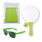 A set of items includes a green mesh towel in packaging, a white paddle with a green handle, a small green ball, and green sunglasses. The items are arranged on a plain white background.