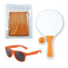 An orange paddle ball set with a paddle, ball, sunglasses, and a bag containing a folded mesh fabric. All items are color-coordinated in orange and white, arranged on a white background.
