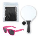 A paddle game set with a white paddle, black ball, and net, accompanied by pink sunglasses. The net is in a plastic package. All items are placed on a white background.