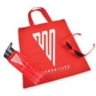 Red promotional items from Versailles Wellness Centres, including a tote bag, water bottle, and sunglasses, all featuring a white logo and text.