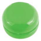 A shiny, lime green yo-yo on a plain white background. The yo-yo is closed, showing its smooth and rounded top surface.
