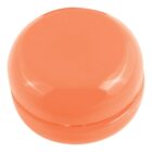 A small, round, orange container with a smooth, glossy finish. It has a lid that fits snugly on top.