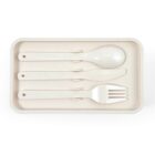 A set of beige cutlery consisting of a spoon, knife, and fork neatly arranged on a rectangular tray. The utensils have a minimalist design with holes at the ends of their handles. The tray has a raised edge for securing the cutlery.