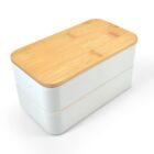 A rectangular lunchbox with a wooden lid and white base, featuring smooth, rounded edges. The box is stacked in two layers, showing a minimalist and modern design.