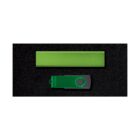 A green USB flash drive and a rectangular green block are positioned side by side on a black background. The USB has a swivel cover with a circular design element.