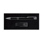 A sleek black pen with silver accents is displayed next to a small, black, rectangular USB flash drive with a circular swivel cover, both set on a dark textured background.