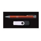 A silver and red pen and a black and white USB flash drive are placed side by side on a black surface.