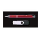 A red pen with a silver clip is placed horizontally above a white and black swivel USB flash drive on a black background.