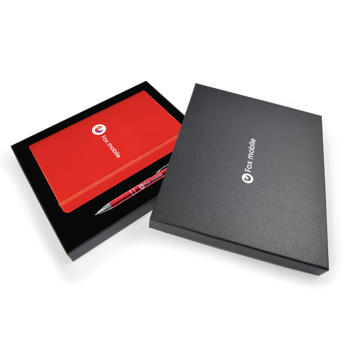A black gift box containing a red notebook and a matching pen, both with a white circular logo and text Fox mobile. Another black box lies beside it, partially open to reveal the notebook and pen inside.