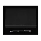 A closed black notebook with an elastic band on a black background. A black and silver pen is placed below the notebook.