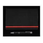 A black notebook with a red elastic band is placed on a black background. Below the notebook, there is a black pen with silver accents resting horizontally.