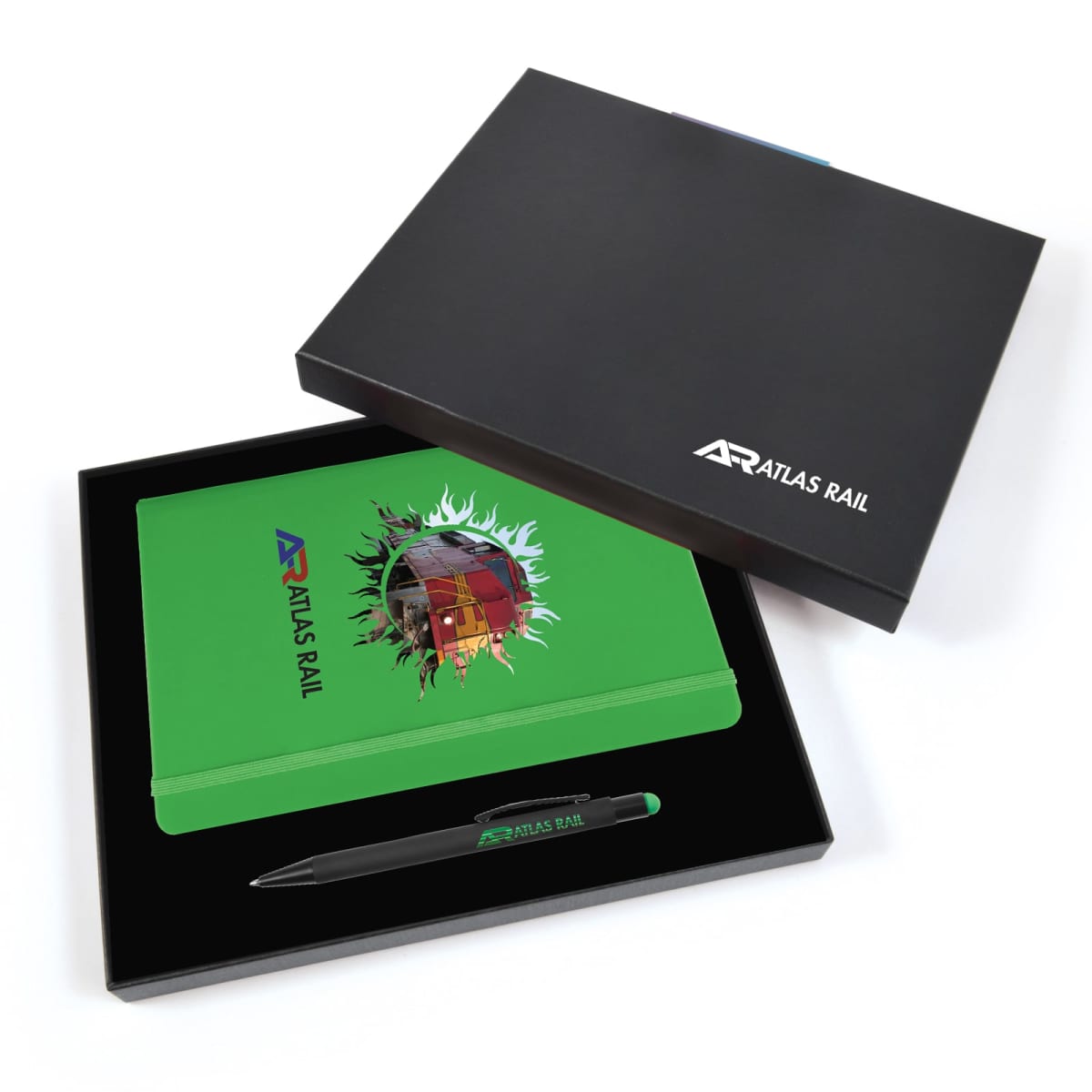 A black presentation box containing a green notebook and a black pen with Atlas Rail branding. The notebook has a graphic with a globe design and the same branding. The box lid is partially open, displaying the items neatly inside.