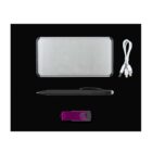 A silver portable charger, a white multi-connector cable, a black pen, and a purple USB flash drive are arranged on a black background.