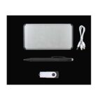 A portable charger, a USB cable, a pen with a touchscreen stylus, and a USB flash drive are neatly arranged on a black background. The portable charger is silver, and the other items are black and white.