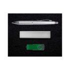 A silver pen, a rectangular silver object, and a green USB flash drive are arranged in a row on a black background. The pen has a metallic clip and grip detailing. The flash drive has a black swivel cover.