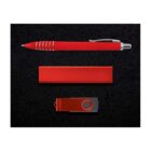 A red pen with silver accents is next to a matching red rectangular object and a red USB flash drive with a swivel cover, arranged on a black background.