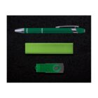 A green pen with silver accents, a rectangular green power bank, and a green USB flash drive with a swivel cover are aligned vertically on a black textured background.