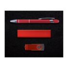 A red pen, a rectangular red box, and a red and black USB flash drive are arranged on a black textured background.