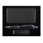 A black gift set containing a rectangular power bank, a black pen with silver accents, and a black USB drive, all placed on a dark textured background.