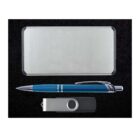 A silver rectangular case beside a blue and silver pen and a silver and black USB flash drive, placed on a black surface.