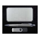 A silver rectangular case, a silver and black pen, and a silver USB flash drive with a black base are neatly arranged on a black textured surface.