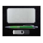 A silver rectangular tin box is placed above a green pen with a silver tip and a metallic USB flash drive with a black plastic casing on a black surface.