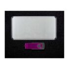 Silver rectangular external hard drive and purple USB flash drive with swivel cover, placed on a black background.