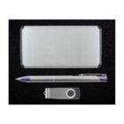 A gift set containing a sleek silver power bank, a silver pen with a blue tip, and a silver USB flash drive with a swivel cover, all arranged neatly on a black background.