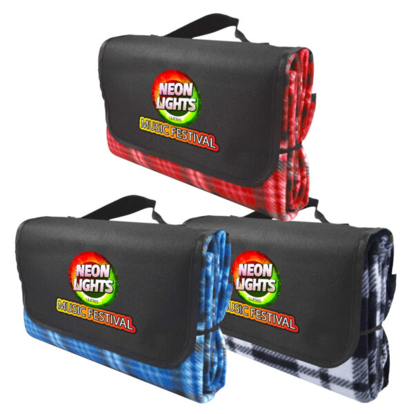 Three folded picnic blankets with carrying handles are displayed in red, blue, and black plaid patterns. Each blanket features a logo for Neon Lights Music Festival on the flap covering the folded section.