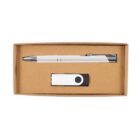 A cardboard box containing a white and silver pen and a matching white USB flash drive with a black circular detail. The box is open, displaying its contents neatly arranged.