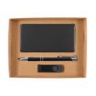 A cardboard gift box containing a black rectangular item, a black and silver pen, and a black USB flash drive.