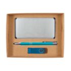 A gift set in a cardboard box containing a silver metal cardholder, a teal pen with silver accents, and a teal USB flash drive.