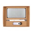 A cardboard box contains a silver metal card holder, a white and silver pen, and a USB flash drive. The items are neatly arranged in compartments within the box.