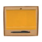 Brown cardboard box containing a closed yellow notebook with an elastic band and a black pen with a red tip, neatly arranged together.