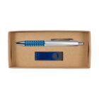 A silver pen with a blue grip featuring small chrome accents, and a blue USB drive, are placed inside an open brown cardboard box. The pen and USB drive are neatly arranged, showcasing a compact and simple packaging design.