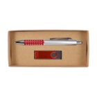 A brown cardboard box containing a silver and red pen with a series of small accents and a red USB flash drive with a swivel metal cover. The items are neatly placed side by side in the box.