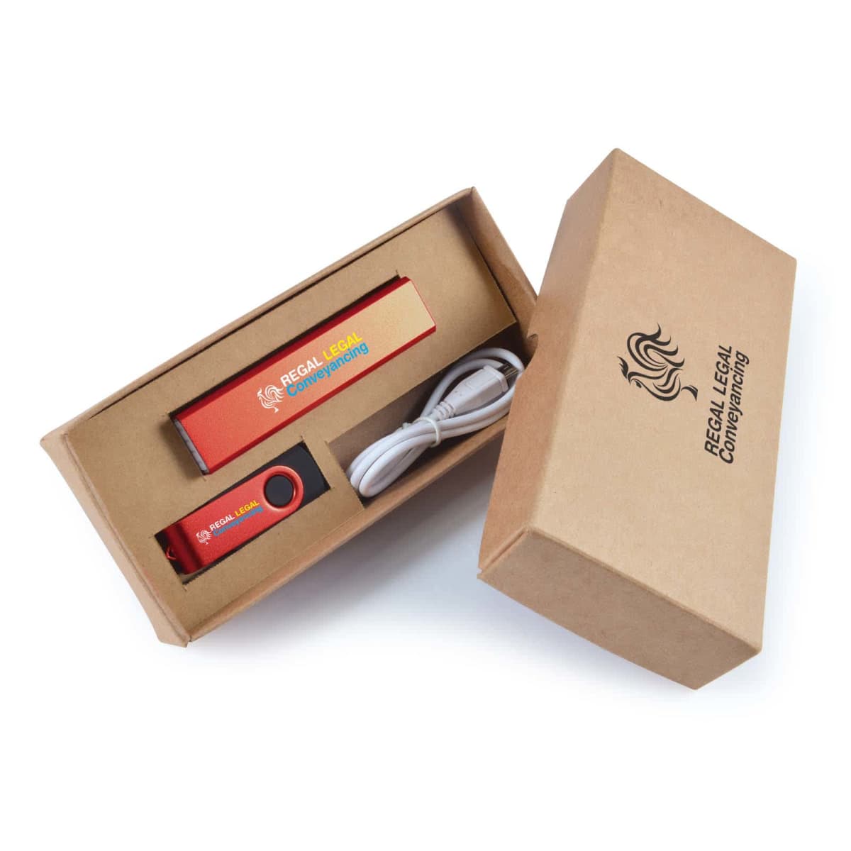 Open cardboard box containing a red and black USB flash drive with Regal Legal Conveyancing branding, a white USB cable, and packaging material, also featuring the logo and text Regal Legal Conveyancing on the box lid.