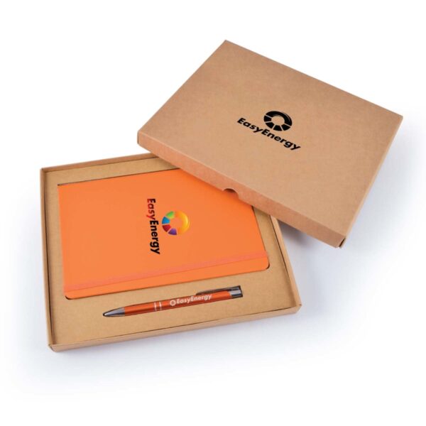 Open cardboard box with a closed orange notebook and a pen inside, both branded with the EasyEnergy logo. The box lid is partially open, showing the same logo. The notebook cover features a colorful circular design.