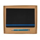 A black notebook with a blue elastic band and a blue and silver pen are placed inside an open brown cardboard box.