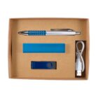 A cardboard box contains a blue and silver pen, a blue rectangular object, a blue USB flash drive, and a white USB cable.