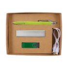 A cardboard box containing a green pen, a metallic rectangular object, a green and silver USB flash drive, and a white USB cable with two connectors. The items are neatly arranged in cutout sections inside the box.