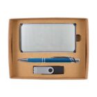 A gift set inside a cardboard box containing a silver rectangular cardholder, a blue and silver pen, and a silver USB flash drive with a black cap.