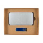 A cardboard box containing a silver external hard drive and a blue USB flash drive with a swivel cover. The hard drive sits above the flash drive, both snugly fitted in their respective compartments.