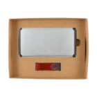 A cardboard box containing a silver laptop and a red USB flash drive, both neatly placed inside with a simple, eco-friendly packaging design.