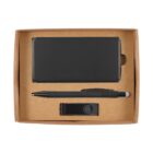 A brown cardboard box containing a black notebook, a black pen, and a black USB flash drive, neatly arranged with each item in its designated compartment.