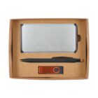 A gift box containing a silver business card holder, a black pen with a stylus tip, and a USB flash drive with an orange casing. The items are neatly arranged in a rectangular cardboard box.