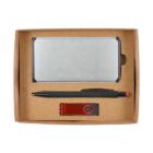 A cardboard gift box containing a silver rectangular power bank, a black pen with a red tip, and a red USB flash drive.