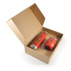 Open cardboard box containing a red insulated water bottle and a red insulated tumbler, both with a bee illustration and text BEEZ NEEZ HONEY on them. The tumbler is placed sideways next to the bottle.